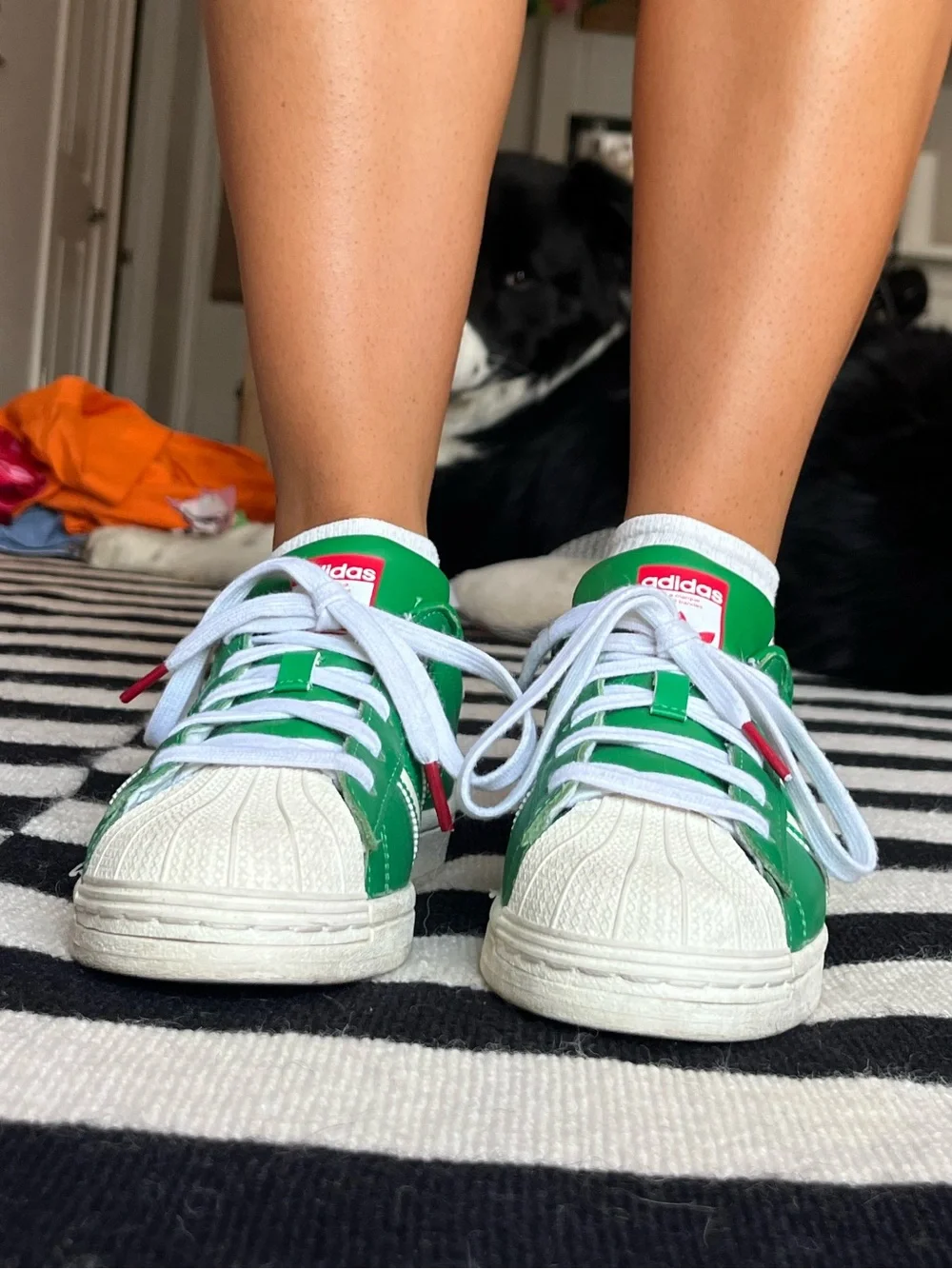 adidas women’s Green and White Superstar Sneakers with Red Logo